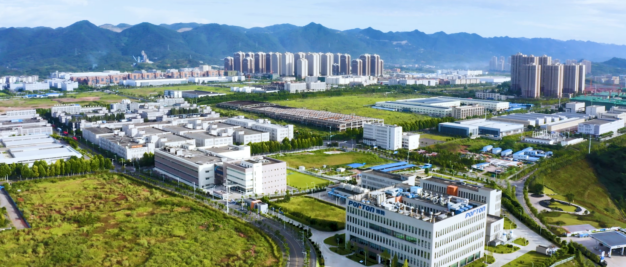 An aerial view of a city with mountains in the background.