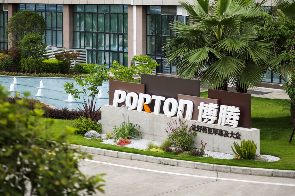 A sign for porton in front of a building.