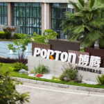 A sign for porton in front of a building.