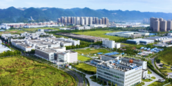 An aerial view of a city with mountains in the background.