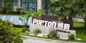 A sign for porton in front of a building.