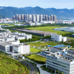 An aerial view of a city with mountains in the background.